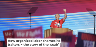 United Auto Workers President Shawn Fain wears a shirt reading ‘Trump is a Scab’ at the Democratic National Convention on Aug. 19, 2024. Andrew Harnik/Getty Images
